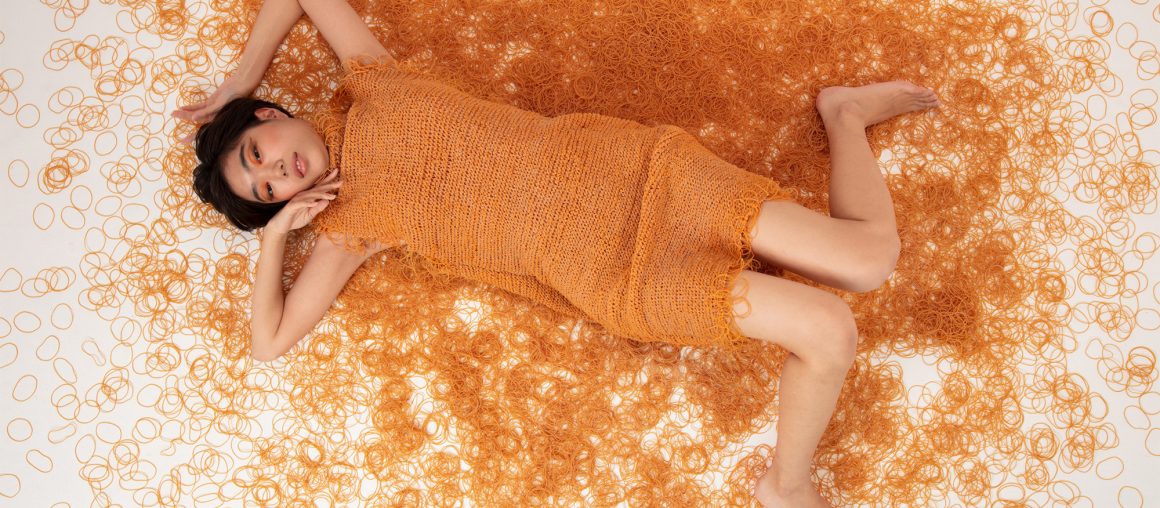 Fringed Orange Apparel Knit Entirely From Rubber Bands by Rie Sakamoto