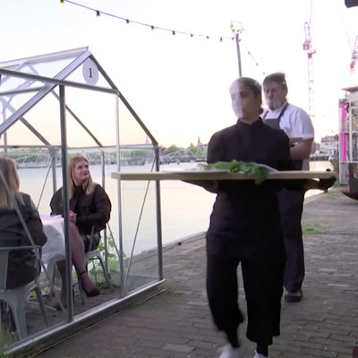 Dutch Restaurant's Social Distancing Techniques: Individual Dining Greenhouses, Food Served on Long Planks - Core77