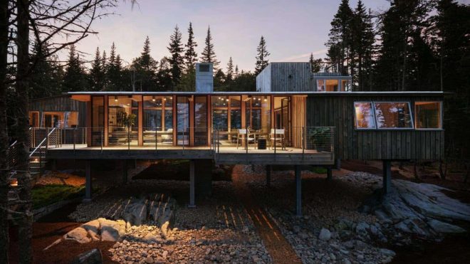 Coastal Cabin On Stilts With Ocean Views Peeking Through The Trees