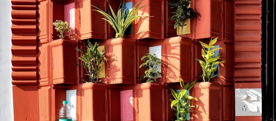 This green wall uses upcycled clay tiles for natural cooling