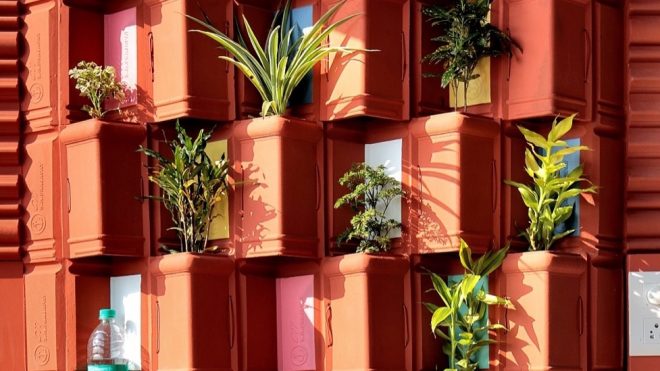 This green wall uses upcycled clay tiles for natural cooling