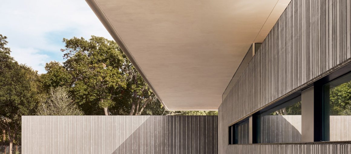 Three cast-concrete volumes form Preston Hollow house by Specht Architects