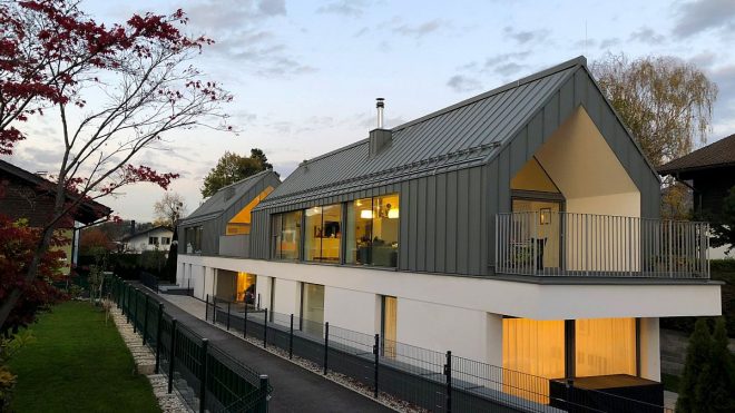 Gabled Roof and Exterior in Gray Give the Two-in-One House an Exceptional Façade