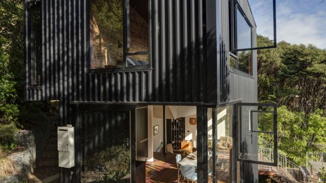 A Black House With A Tower-Like Design In The Canopies of New Zealand