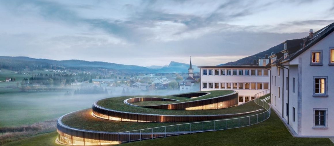 BIG’s swirling watch museum opens in the Swiss mountains