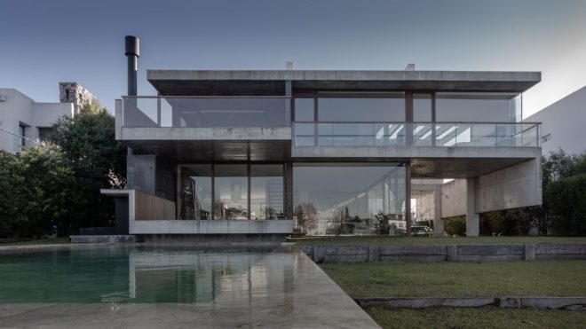 Exposed Concrete and Glass House On a Beautiful Lake Shore