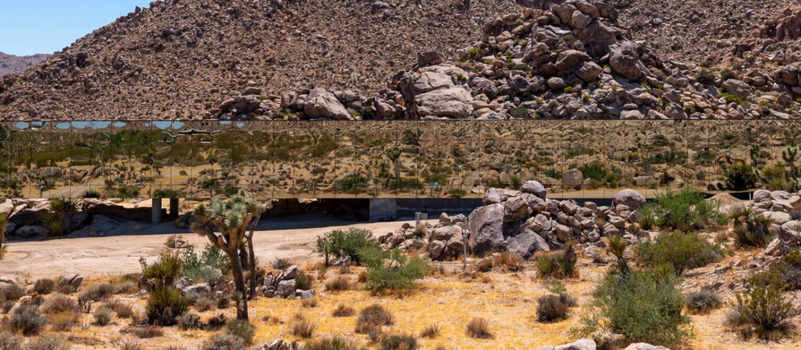 The Invisible House is a reflective building that mirrors its desert surroundings