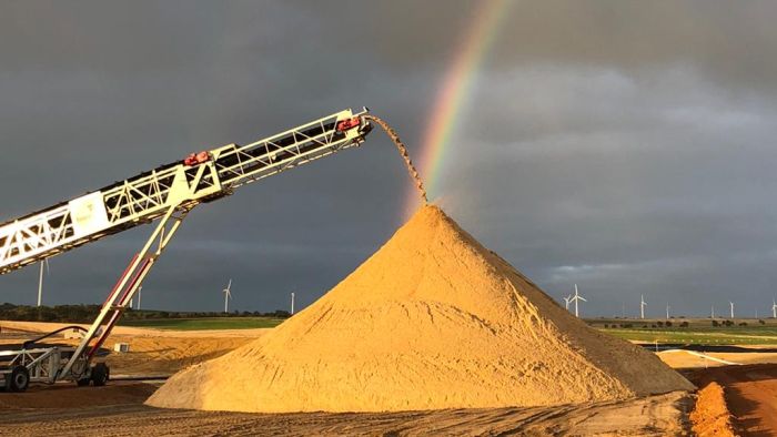 Construction sand mining a new export as first shipment heads to Singapore
