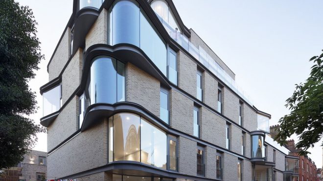 Contemporary Apartment Block In London With Bow Windows and Brick Facades