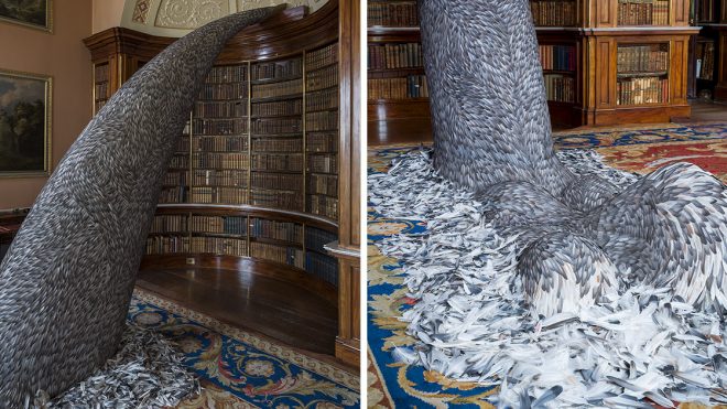 10,000 Pigeon Feathers Cascade from a Bookcase in Kate MccGwire's Latest Installation