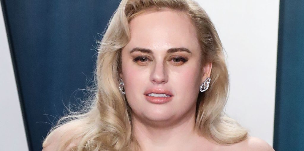 Rebel Wilson Wows in a Ruched Dress & Peek-a-Boo Mesh Pumps for a Good Cause