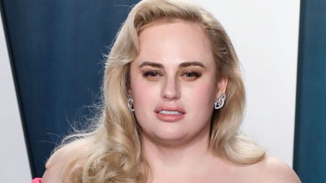 Rebel Wilson Wows in a Ruched Dress & Peek-a-Boo Mesh Pumps for a Good Cause