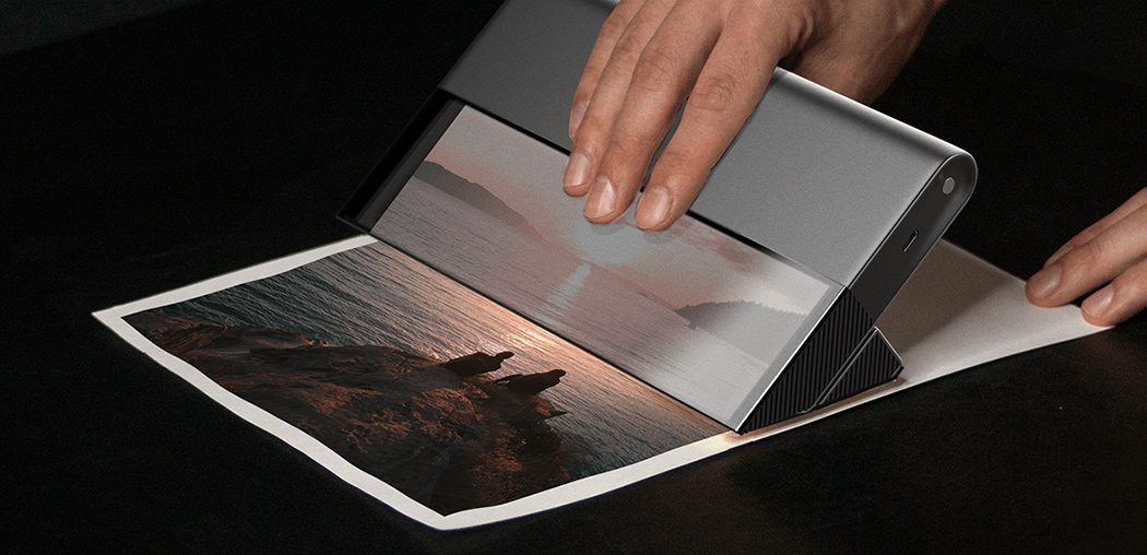 This handheld portable printer + scanner seamlessly prints on any flat surface!