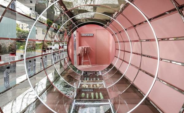 Nax Architects created pop-up shop that features pinkish time tunnel for tea cosmetics brand